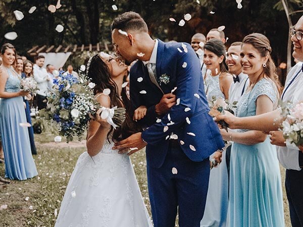 couple kissing at their wedding party